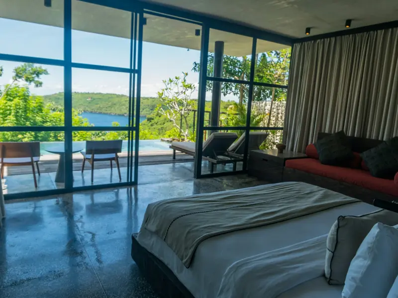 Bedroom with a wall of windows